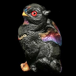 Sitting Griffin Chick Sculpture in Black Sunset